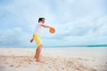 Little boy playing frisbee