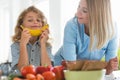 Boy playing with fruit during a visit to a dietitian