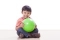 Little boy playing green ball Royalty Free Stock Photo