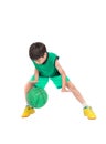 Little boy playing green basketball in green PE uniform sport