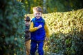 Little boy is playing hide and seek outdoors Royalty Free Stock Photo