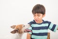 Little boy playing with his friend dog jack russel Royalty Free Stock Photo