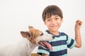 Little boy playing with his friend dog jack russel Royalty Free Stock Photo