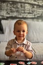 Little boy playing with letters and numbers on a table Royalty Free Stock Photo