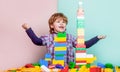 Little boy playing with lots of colorful plastic blocks constructor. Boy playing with construction blocks at Royalty Free Stock Photo