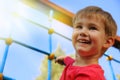 Little boy playing on monkey bars Royalty Free Stock Photo