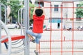 Little boy playing on monkey bars at playground Royalty Free Stock Photo