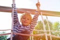 Little boy playing on monkey bars at playground Royalty Free Stock Photo