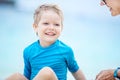 Little boy playing with mother on the beach Royalty Free Stock Photo