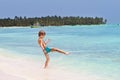 Little boy playing in the ocean on tropical beach Royalty Free Stock Photo