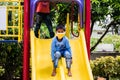 A little boy playing in a park while wearing a mask after covid 19 lockdown has been lifted in India