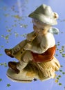 Little boy playing pipe statuette Royalty Free Stock Photo