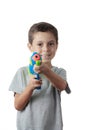 Little boy playing with plastic water gun Royalty Free Stock Photo