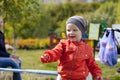 Little boy playing on the playground in the autumn park Royalty Free Stock Photo