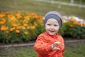 Little boy playing on the playground in the autumn park Royalty Free Stock Photo