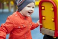 Little boy playing on the playground in the autumn park Royalty Free Stock Photo