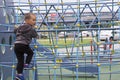 Little boy playing on playground in summer outdoor park