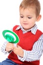 Little boy playing with police signalling disc