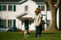 Little boy playing with puppy. Happy child walking dog. Royalty Free Stock Photo