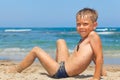 Little boy playing in sand on the beach Royalty Free Stock Photo