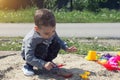 Little boy is playing in the sand Royalty Free Stock Photo