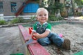 The little boy playing in the sandbox. Royalty Free Stock Photo