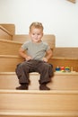 Little boy playing on stairs Royalty Free Stock Photo