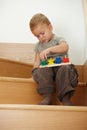 Little boy playing on stairs Royalty Free Stock Photo