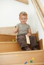 Little boy playing on stairs Royalty Free Stock Photo