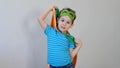 Little boy playing a superhero. Kid in an Superhero`s costume. happy child. green mask, nature care concept Royalty Free Stock Photo