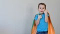 Little boy playing a superhero. Kid in an Superhero`s costume. happy child. green mask, nature care concept Royalty Free Stock Photo