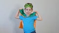 Little boy playing a superhero. Kid in an Superhero`s costume. happy child. green mask, nature care concept Royalty Free Stock Photo