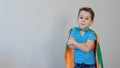 Little boy playing a superhero. Kid in an Superhero`s costume. happy child. green mask, nature care concept Royalty Free Stock Photo