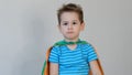 Sad boy superhero. little boy playing a superhero. Kid in an Superhero`s costume. child green mask, nature care concept Royalty Free Stock Photo