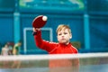 Boy playing table tennis indoors Royalty Free Stock Photo
