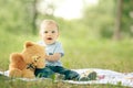 Little boy playing with a teddy bear Royalty Free Stock Photo