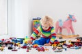 Little boy playing with toy cars Royalty Free Stock Photo