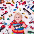 Little boy playing with toy cars Royalty Free Stock Photo