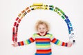 Little boy playing with toy cars. Toys for kids. Royalty Free Stock Photo