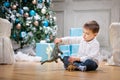 Little boy playing with a toy dinosaur Royalty Free Stock Photo