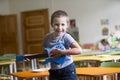 Little boy is playing on a toy guitar. Royalty Free Stock Photo