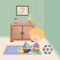 Little boy playing with toys in the room Royalty Free Stock Photo