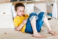 Boy playing video games on portable device Royalty Free Stock Photo