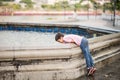 Little boy playing water over fountain outdoor Royalty Free Stock Photo