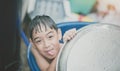 Little boy playing water splash at the backyard outdoor activities summer time Royalty Free Stock Photo