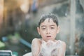 Little boy playing water splash at the backyard outdoor activities summer time Royalty Free Stock Photo