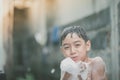 Little boy playing water splash at the backyard outdoor activities summer time Royalty Free Stock Photo