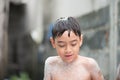 Little boy playing water splash at the backyard outdoor activities summer time Royalty Free Stock Photo