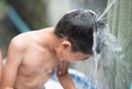 Little boy playing water splash at the backyard outdoor activities summer time Royalty Free Stock Photo