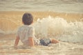 Little boy playing with wave and sand on Pattaya beach Royalty Free Stock Photo